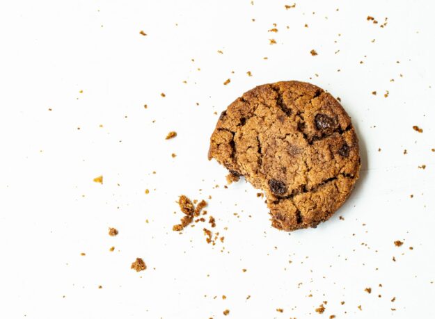 Photo by Vyshnavi Bisani brown round cookie on white surface